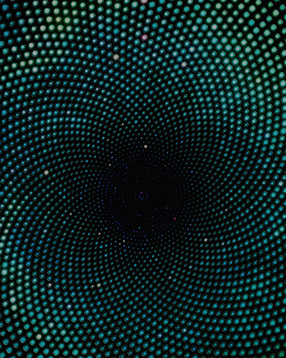 Concentric rings of light radiating from a still centre